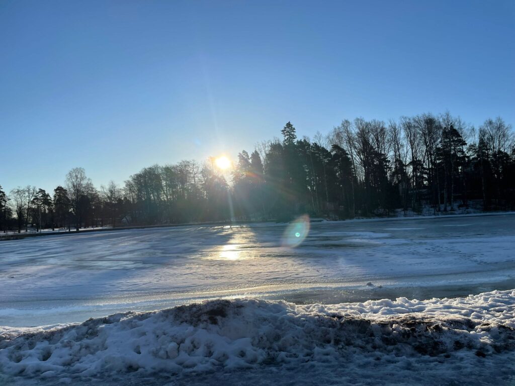 Frozen sea and bridge in Helsinki, Finland during winter with blue sky