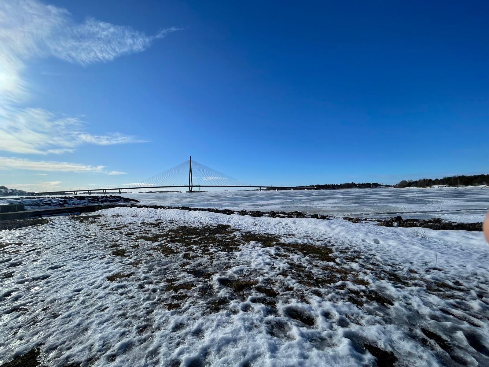 I Flew to Finland for a Girl and Accidentally Fought Snow Frozen sea and bridge in Helsinki, Finland during winter with blue sky